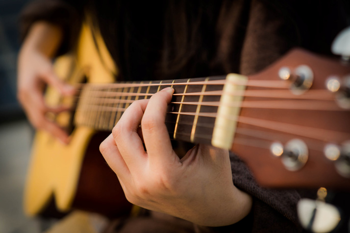 guitar player strumming